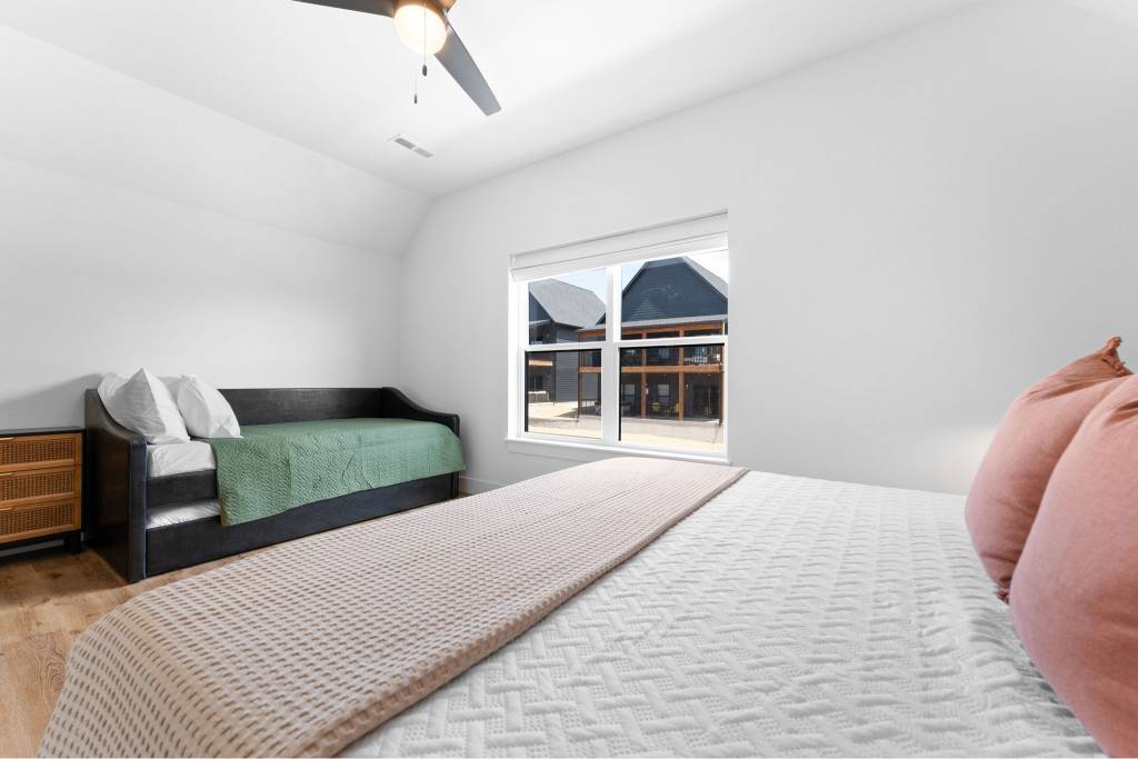 Upstairs king bedroom with trundle bed and ensuite bathroom