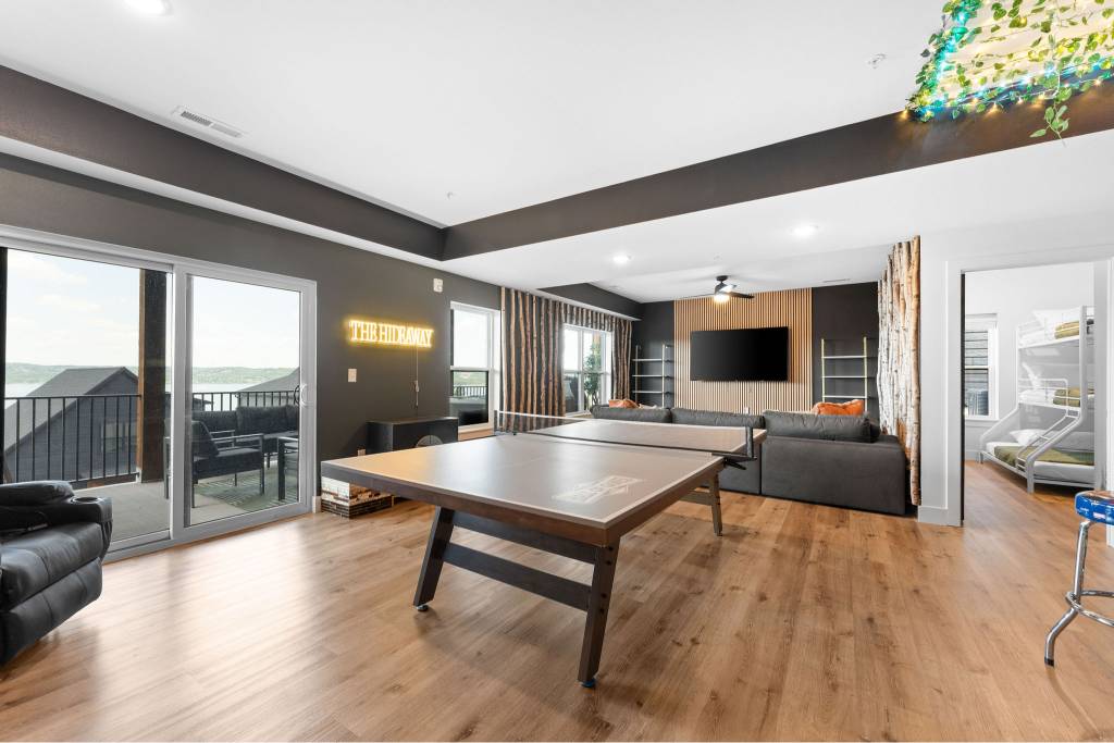 Lower level entertainment space with ping pong and family room