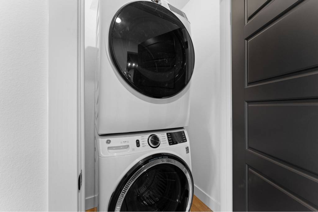 Into the Forest includes 2 laundry rooms in home with stacked washer/dryer in each