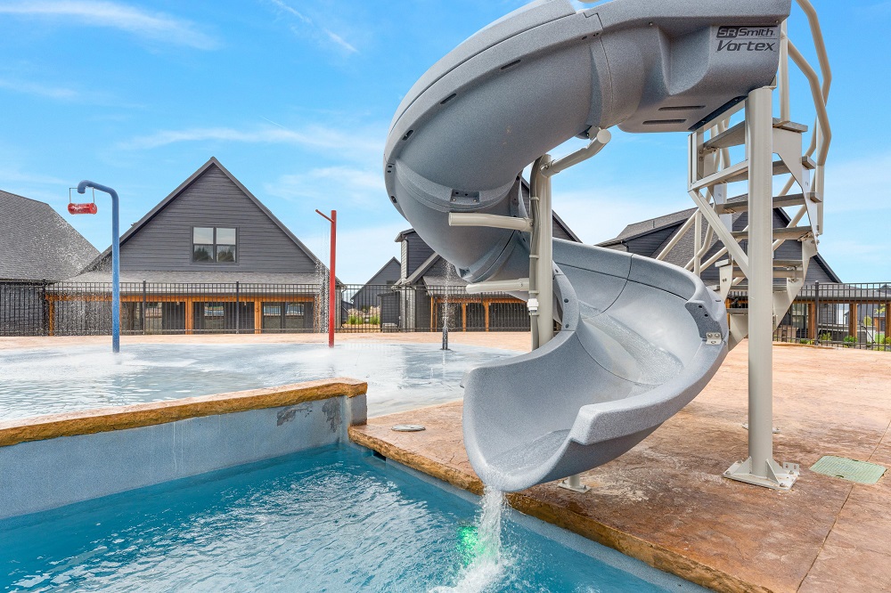 Zoom down the big outdoor slide into the pool—perfect for kids and grown-ups alike.