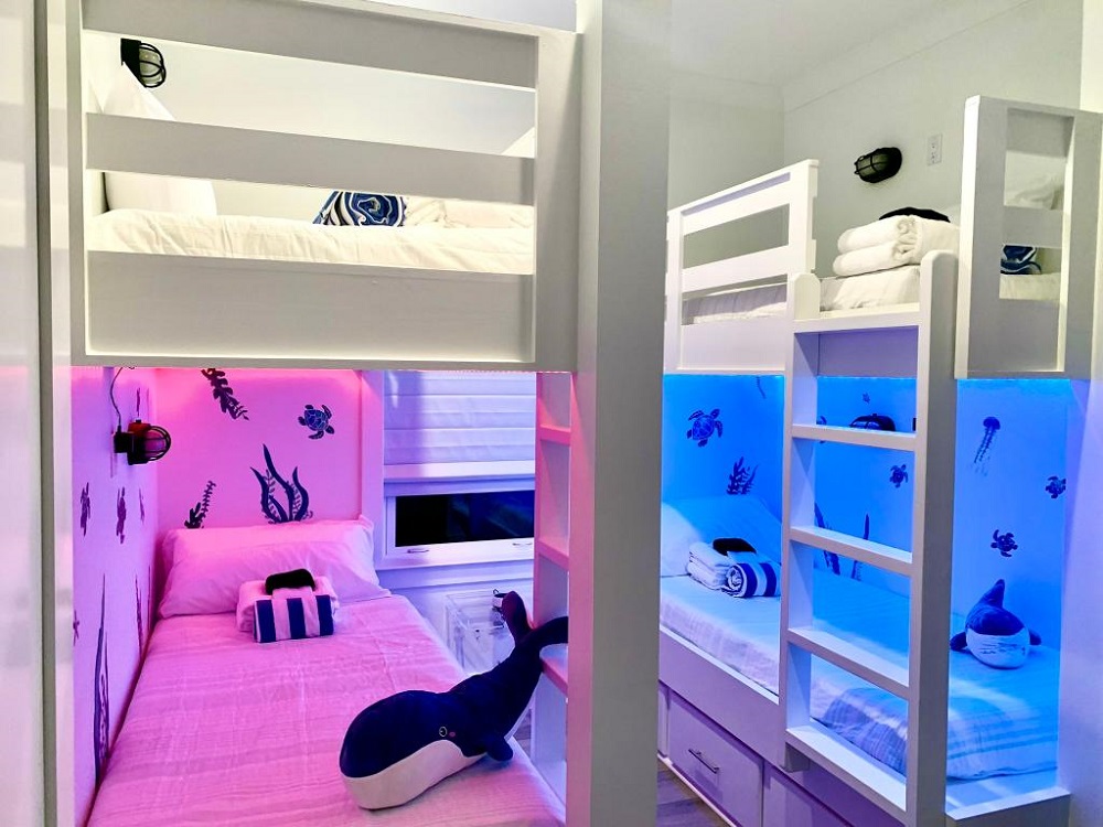 Sleepovers just got more exciting—colorful lights and under-the-sea vibes make this bunk room a kid favorite!