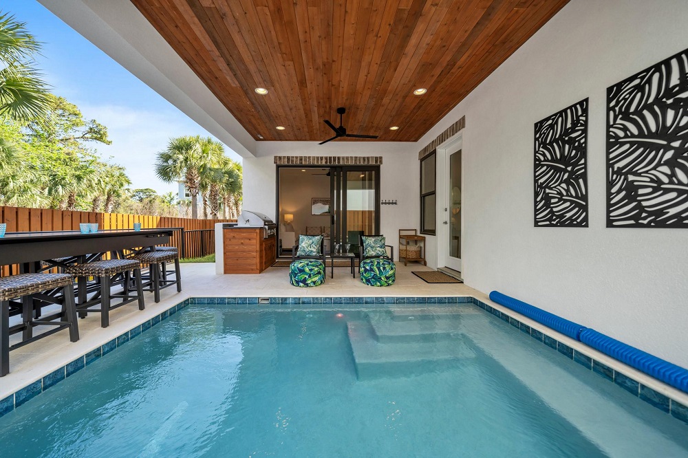 Grill, swim, or kick back with a game—this covered patio has everything for a fun-filled day in the sun (or shade!).