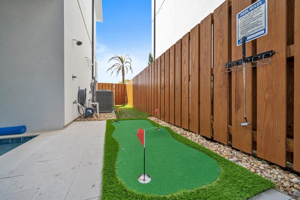Hit a few putts, then rinse off in the outdoor shower—just steps from the pool and perfect after a beach day.