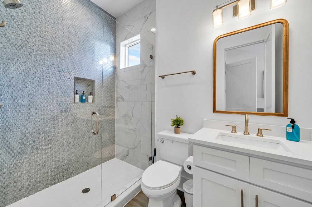 Refresh in this beautifully tiled shower—modern touches that make every rinse feel like a spa day.
