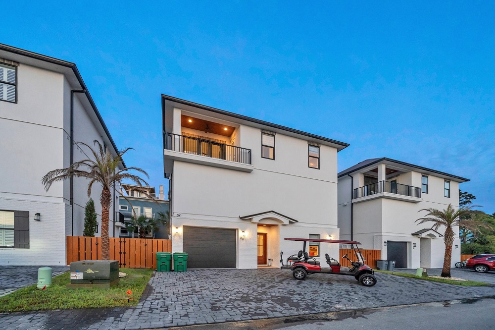 Plenty of space to relax and roam—this three-story beach house includes a golf cart so your crew can explore with ease!