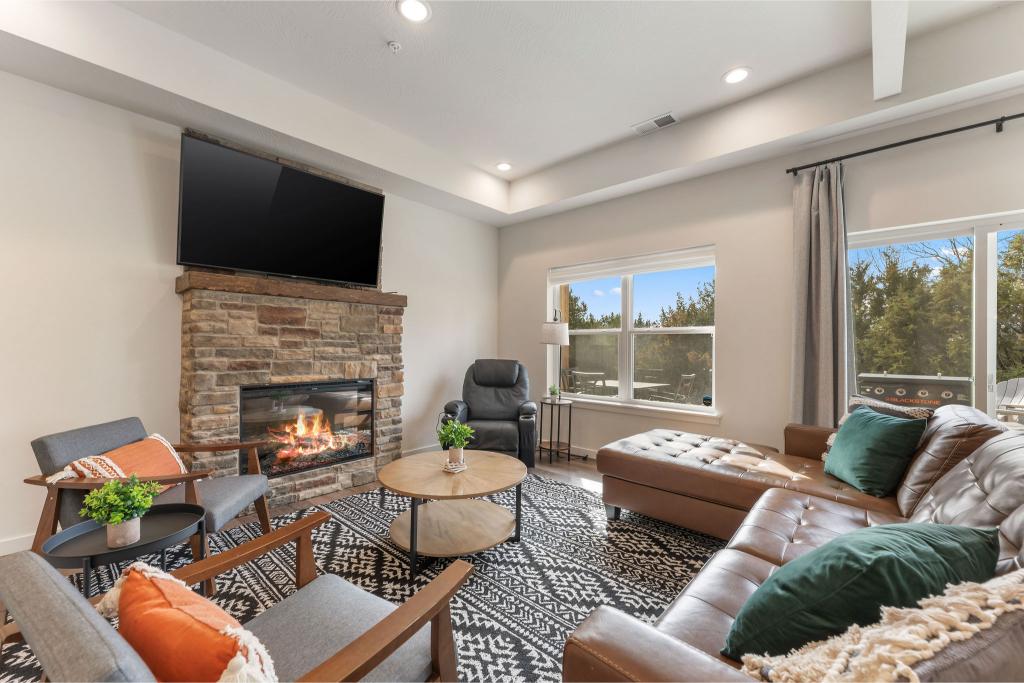 Gather in the cozy living room for movie night or nap time—complete with a big-screen TV and a recliner that massages away the day.