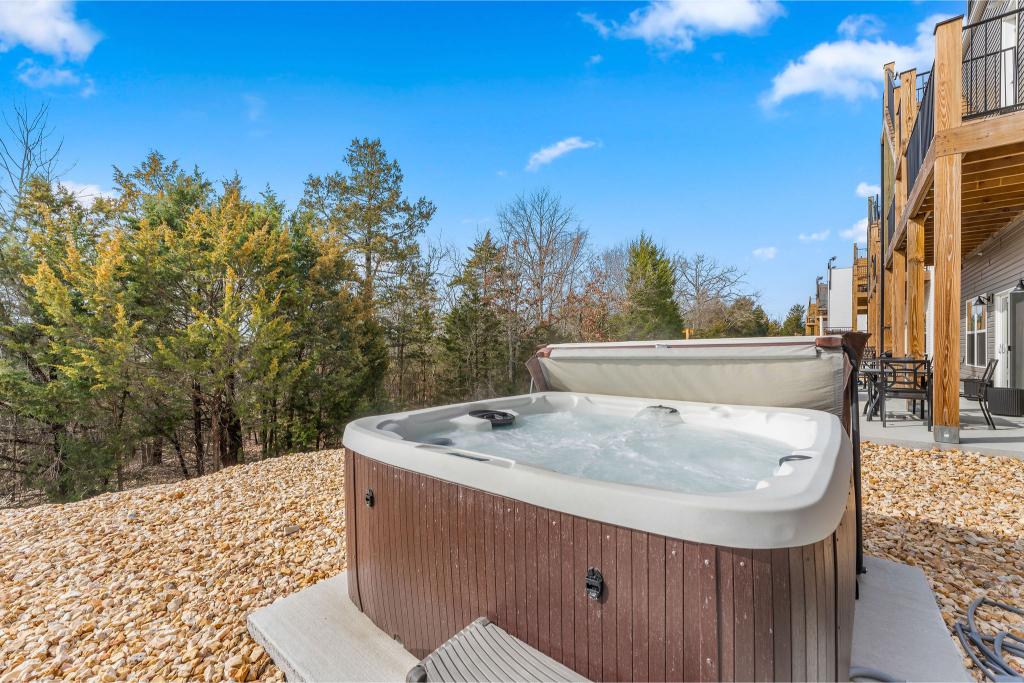 Unwind in the bubbling hot tub just steps from the shoreline—your lake escape starts here!