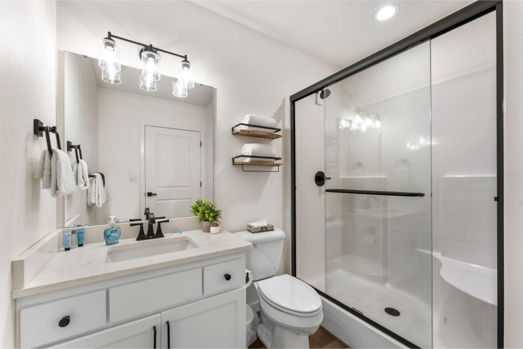 No need to share! This king bedroom includes its own bathroom retreat, just for you.