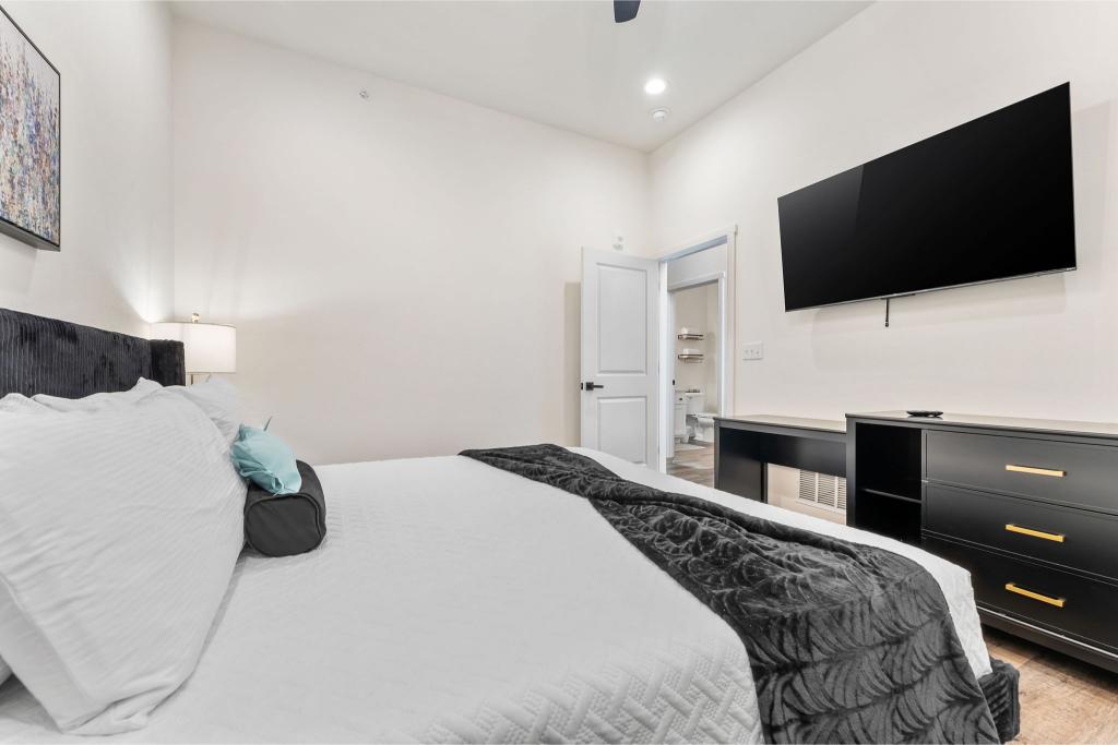 Wind down with your favorite shows in bed and enjoy the privacy of your own bathroom retreat.