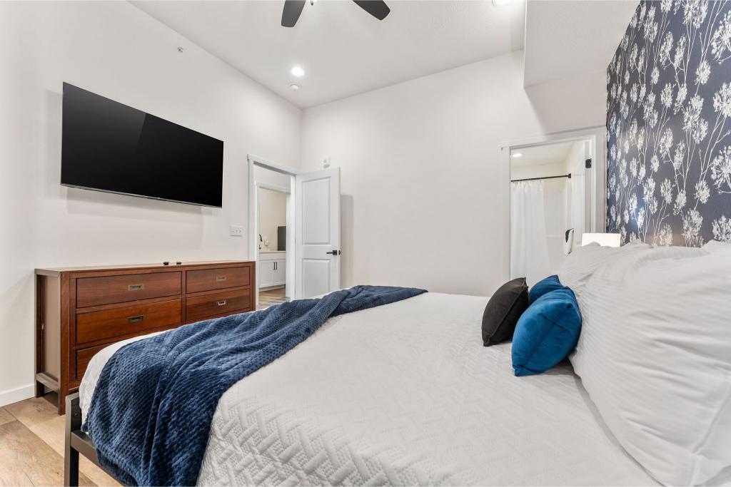 Wind down with your favorite shows in bed and enjoy the privacy of your own bathroom retreat.