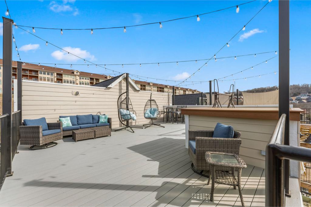 Twinkling lights, lake views, and cozy seating make the rooftop a guest favorite at Big Dipper