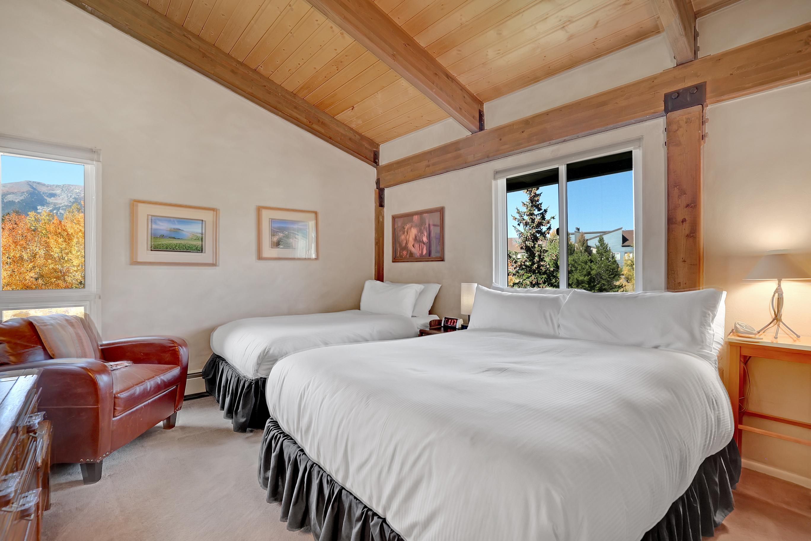 Main floor queen and twin bedroom with soaring mountain views!