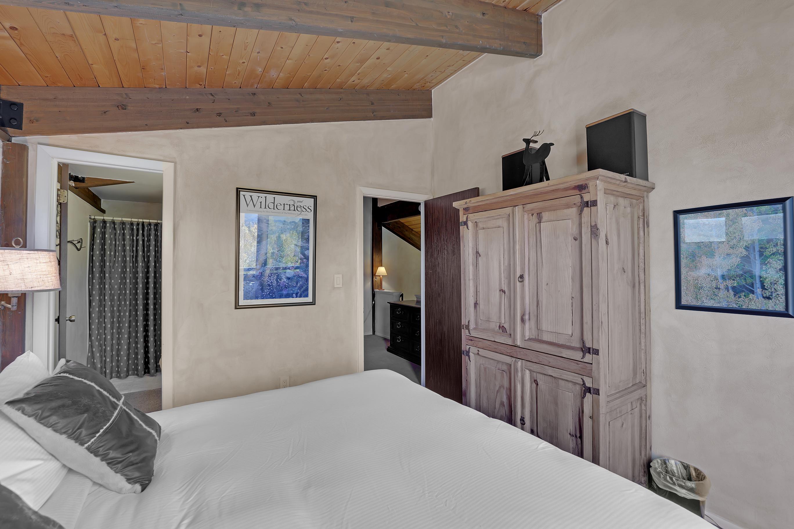 Upstairs cozy king bedroom includes an ensuite bathroom and secluded loft area.