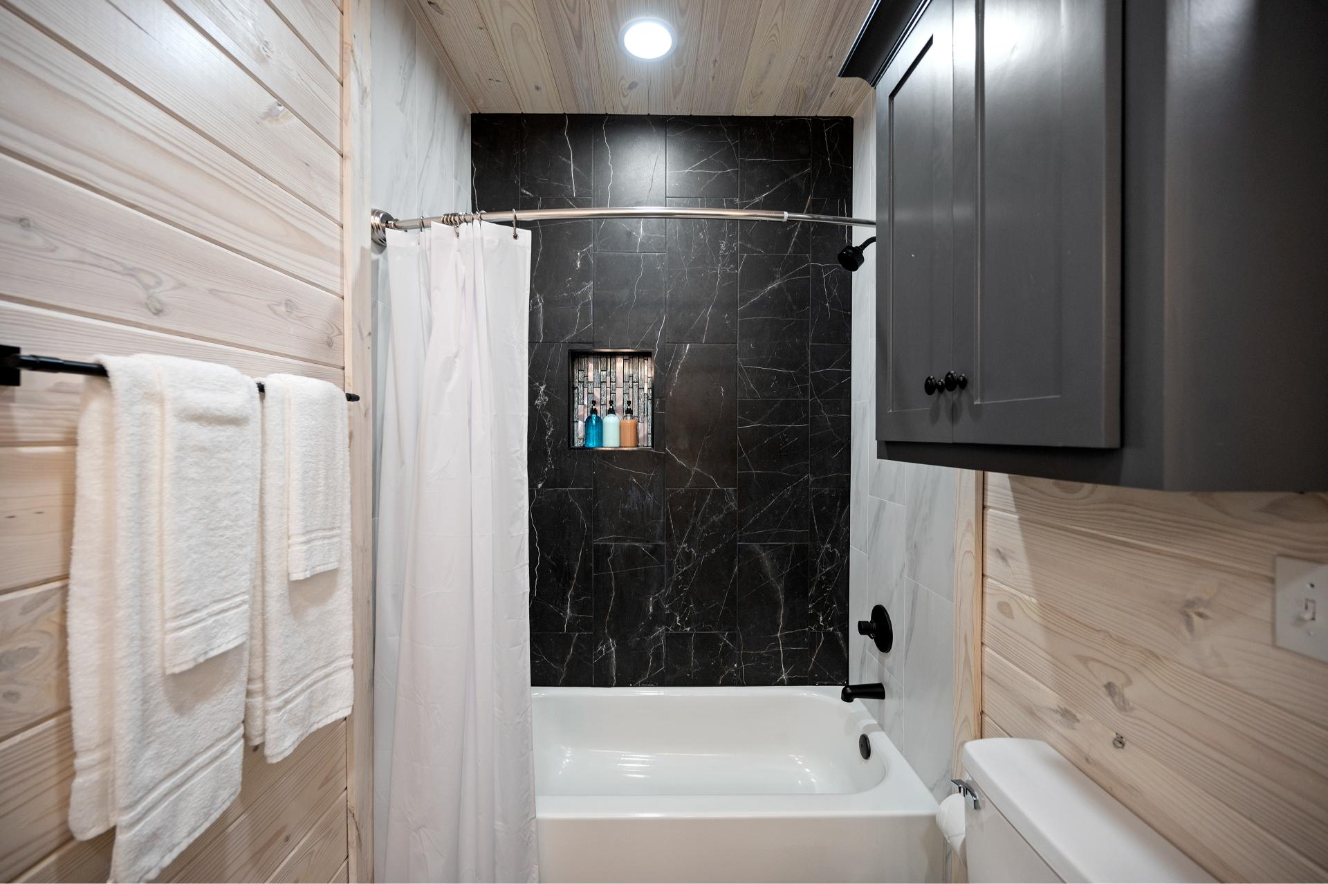 Whether you need a quick rinse or a relaxing soak, this spa-like tub and shower combo has you covered after a full day of fun.