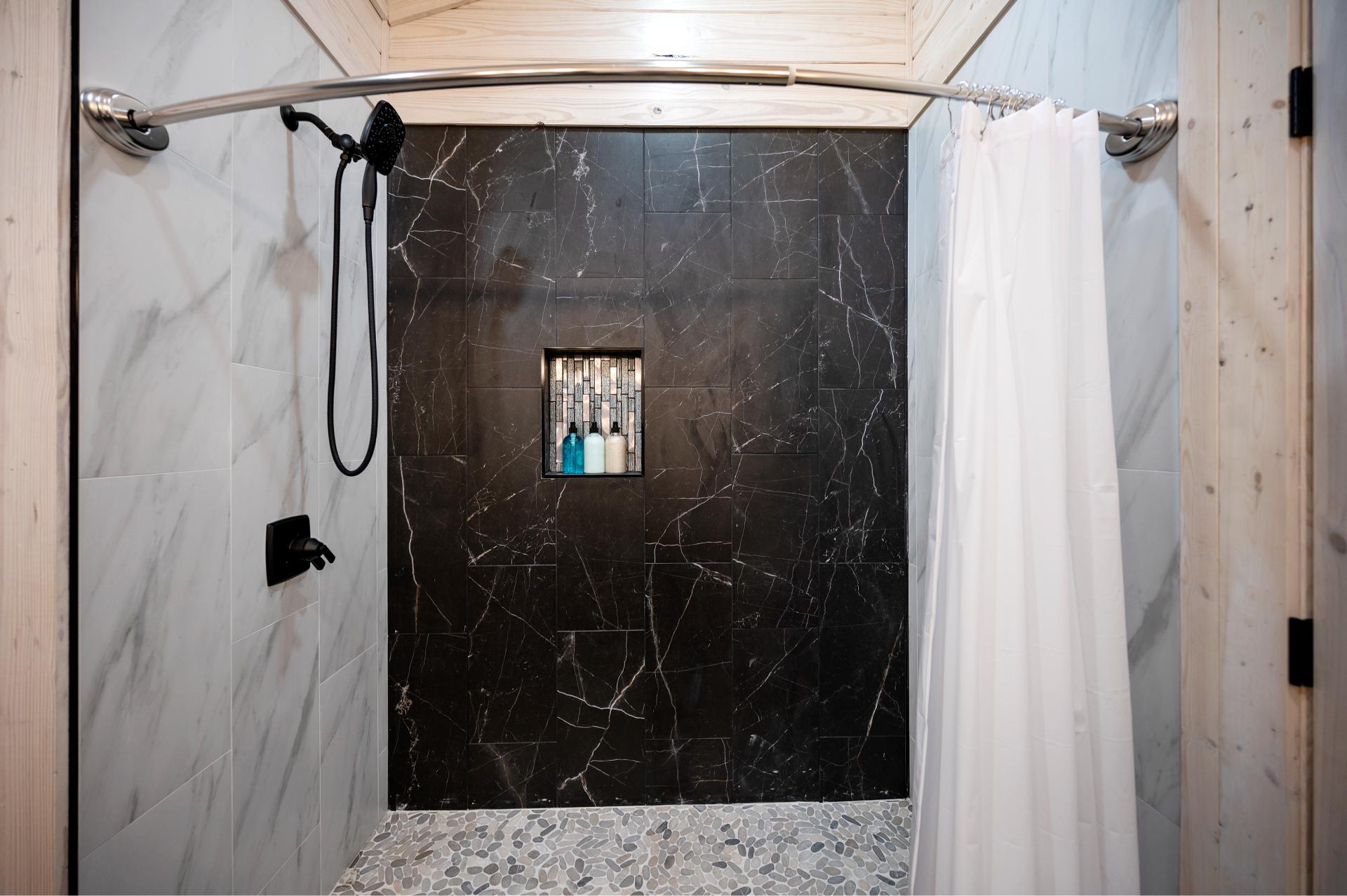 Rinse, relax, and refresh in this extra-large tile shower that’s perfect after a day of fun and adventure.