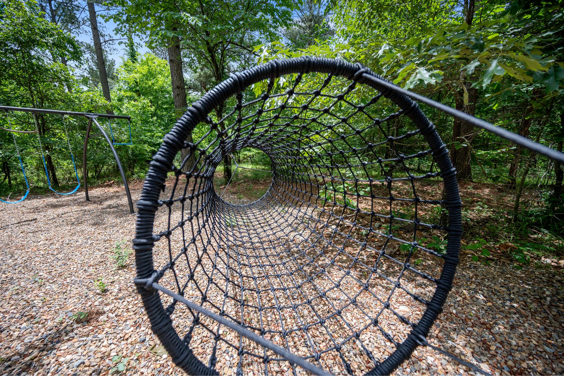 Climb, crawl, and explore! The rope tunnel lets little adventurers stretch their legs and imaginations.