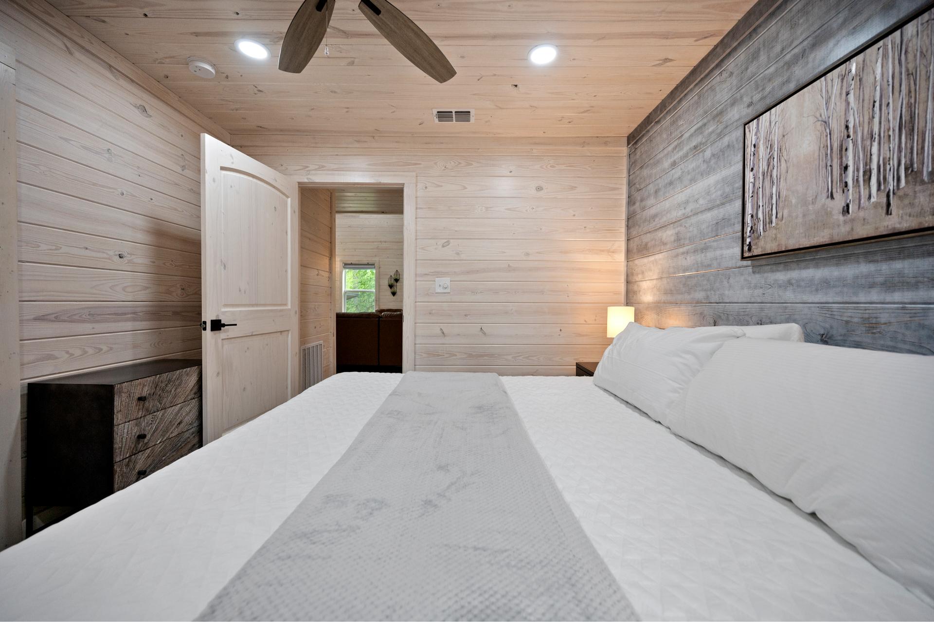 Steps from the fun upstairs, this king bedroom is a cozy spot to relax with your favorite show or a good night’s sleep.