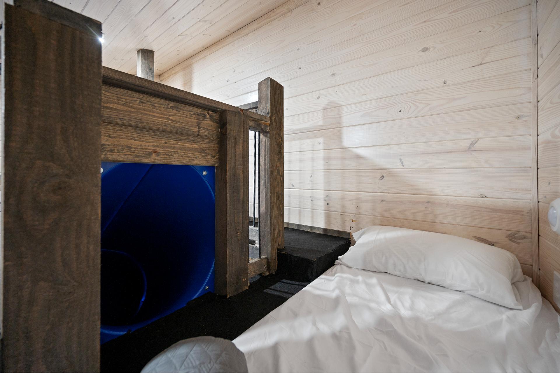 Slide into the day with big grins—this bunk room is every kid’s dream come true!