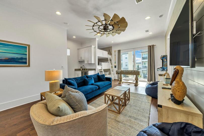 Second-floor den is packed with fun! Foosball, arcade games, large Smart TV, board games, and a wet bar—perfect for movie nights or friendly competition.