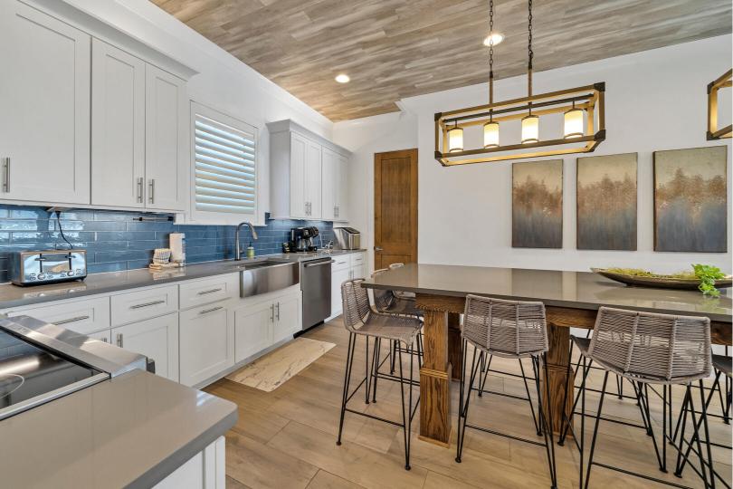 Walk-in pantry just off the kitchen, with a high chair provided—convenient for families with little ones.