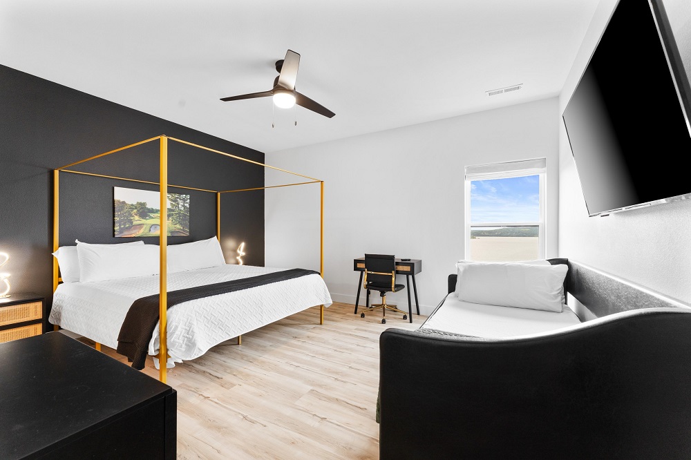 Pine Valley Room: King bed, twin trundles, desk, Smart TV, and ensuite—comfort and function for families or groups.