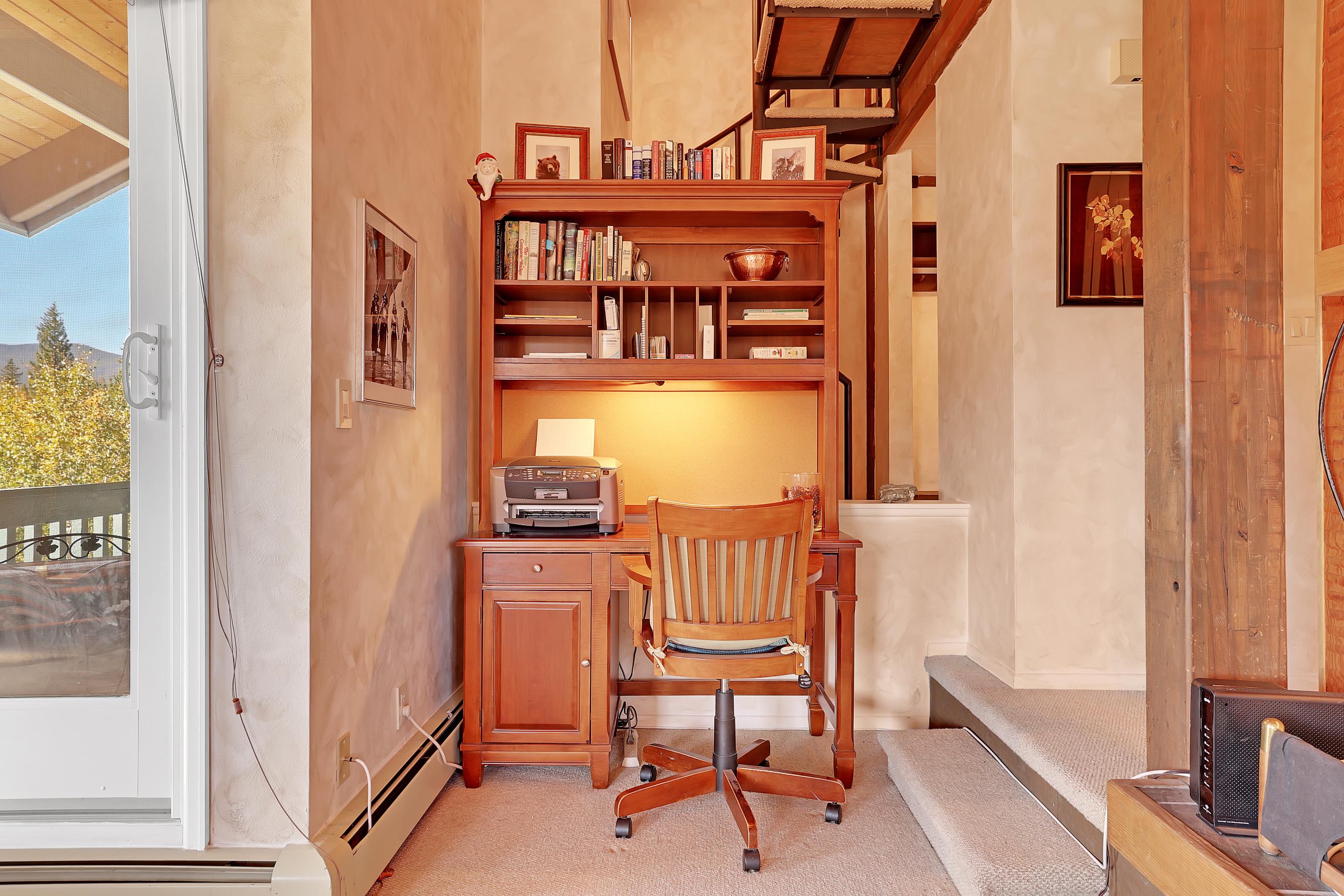 Just off the living room is a work desk with printer, books, and misc office items - great setup for remote work. Stay longer and work remotely!