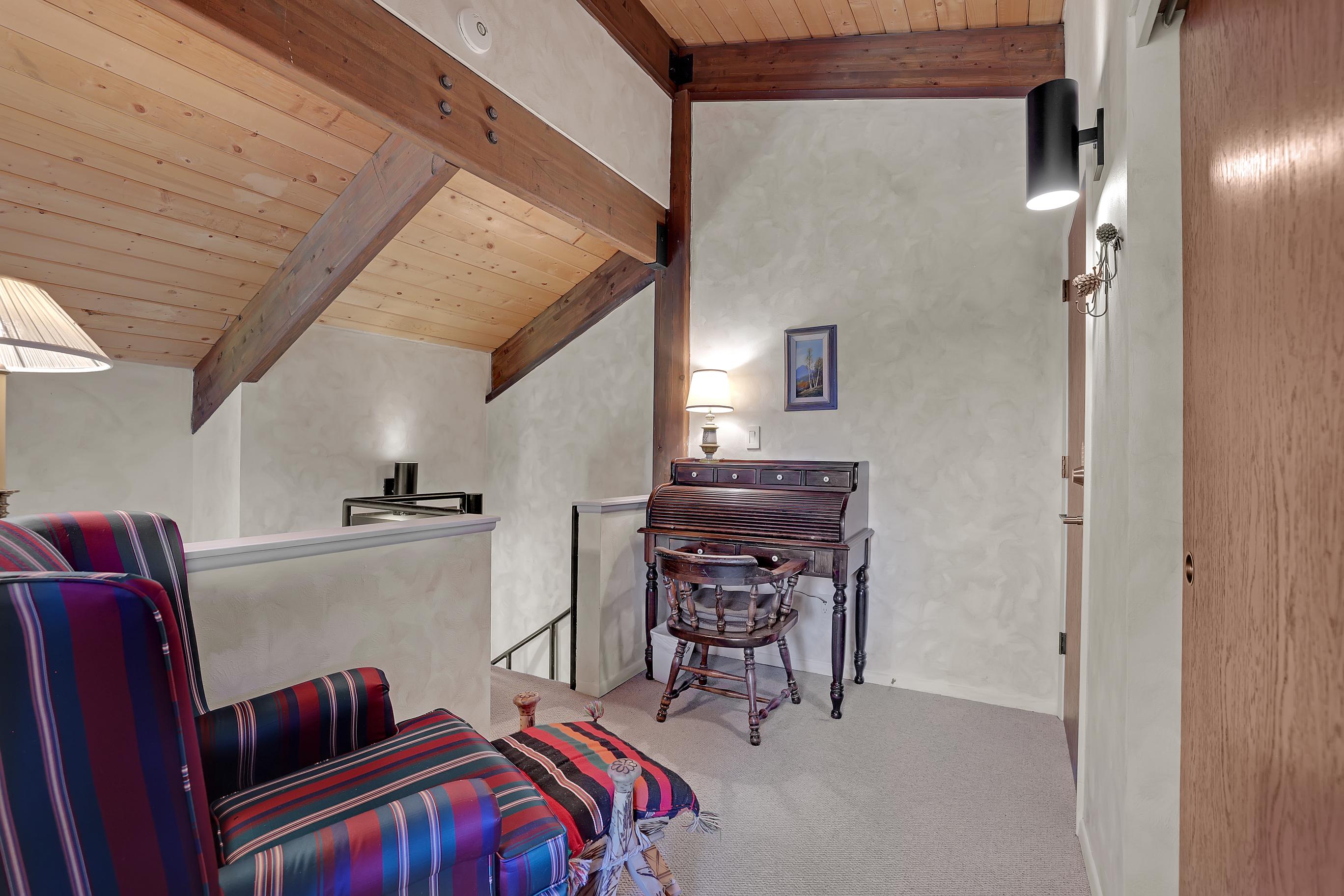 Lofted seating and work station just outside of the upstairs king suite