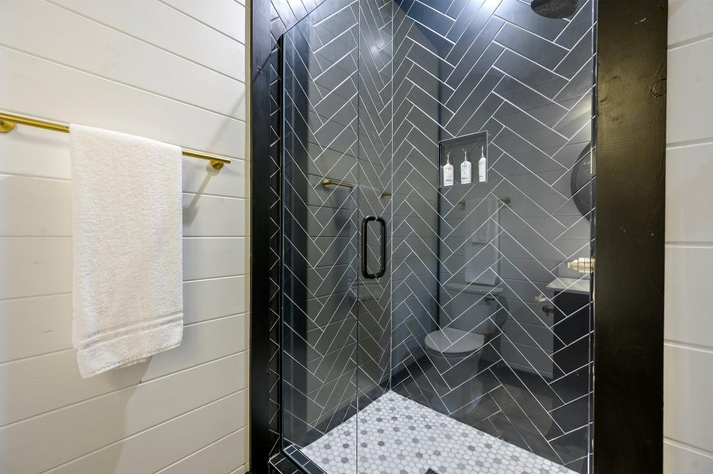  Get ready in comfort with a sleek, spa-like tile shower all to yourself.