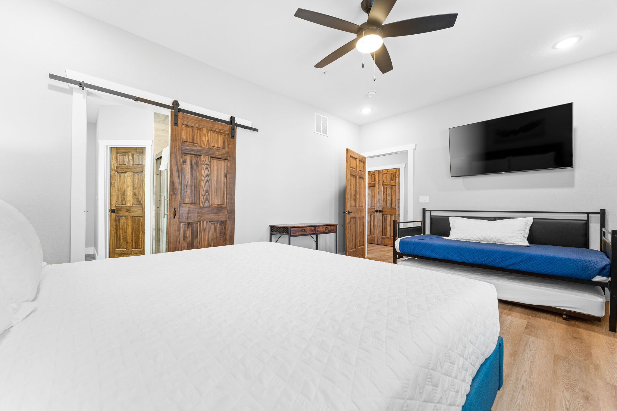 Two twin beds and a desk make this space great for relaxing or getting some work done.