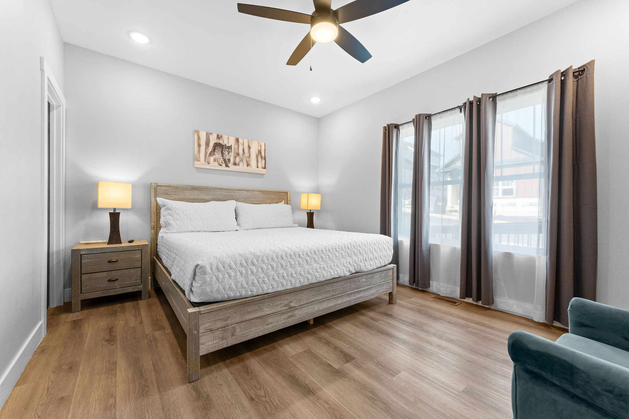 Your second main-floor retreat includes a comfy chair—ideal for reading or unwinding.