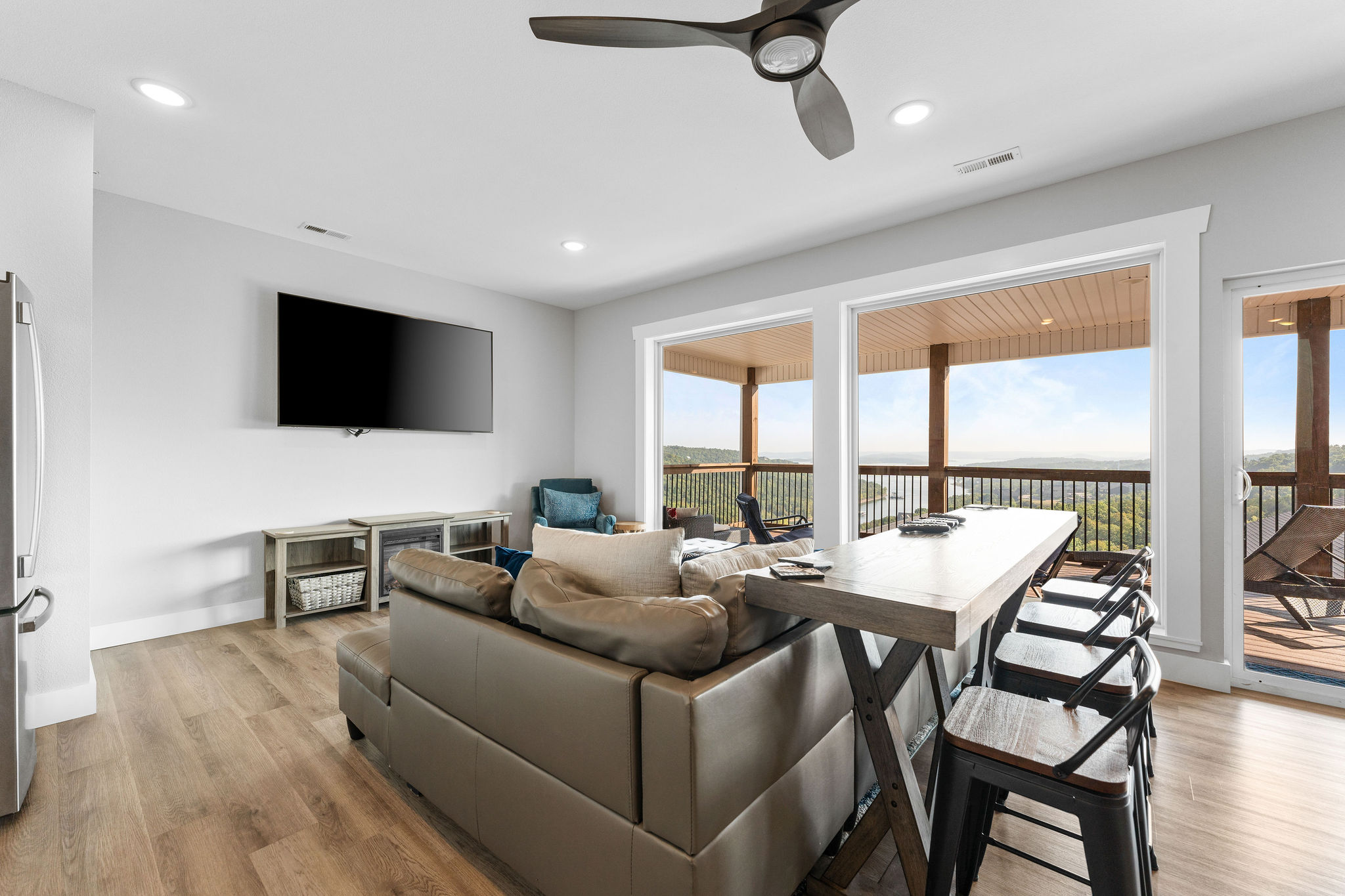 Kick back upstairs—cozy fireplace, game table, and big screen make it a perfect hangout!