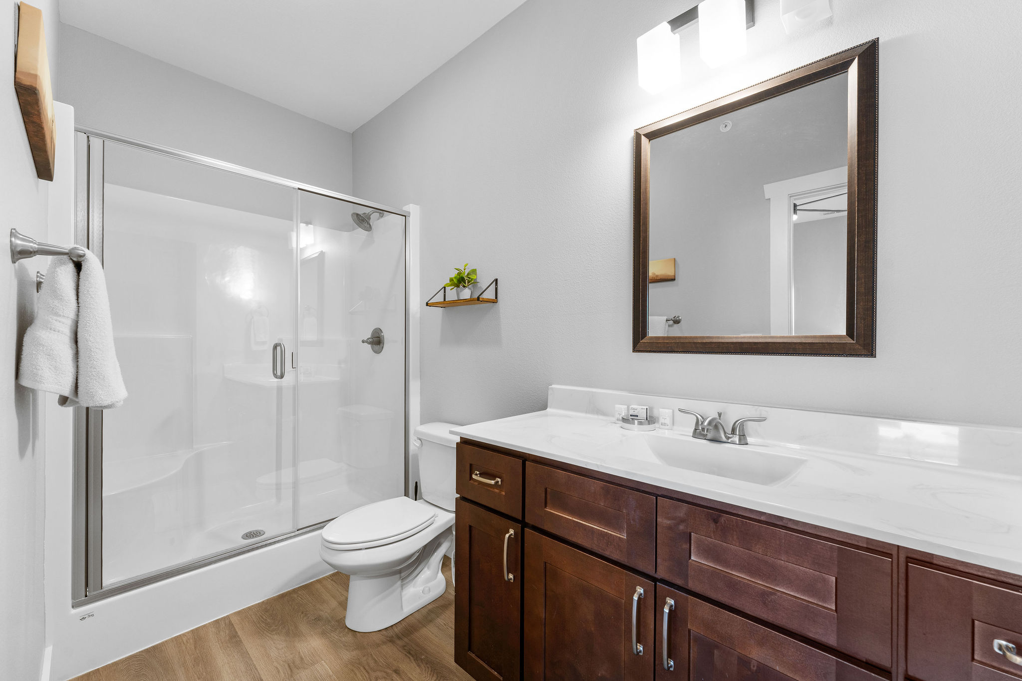 Hop in the shower or unwind—this ensuite has everything you need!