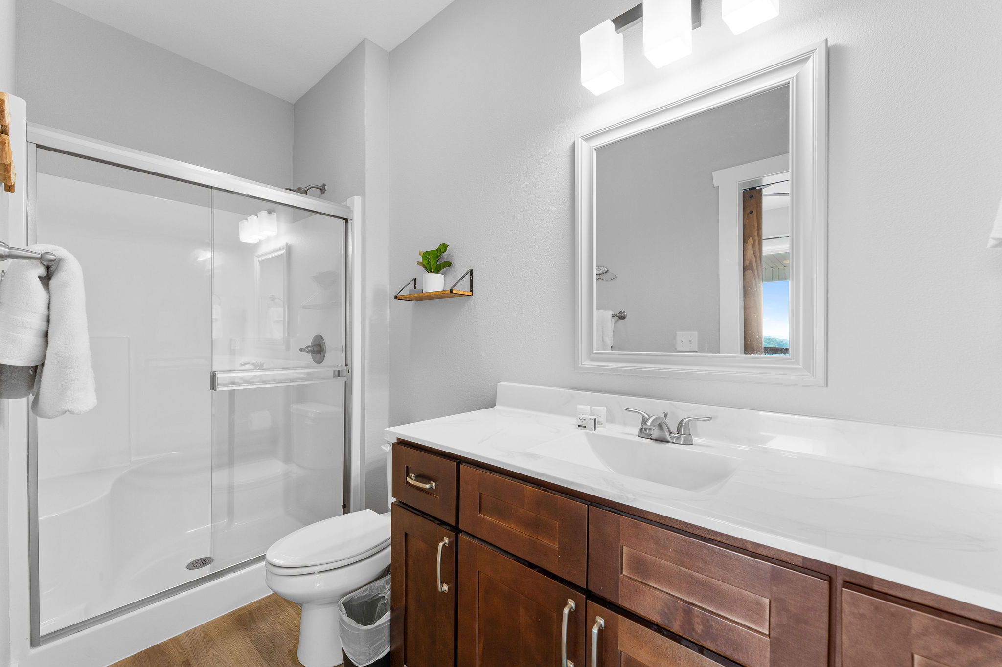 Enjoy a sleek and clean bathroom—just steps from your bedroom!