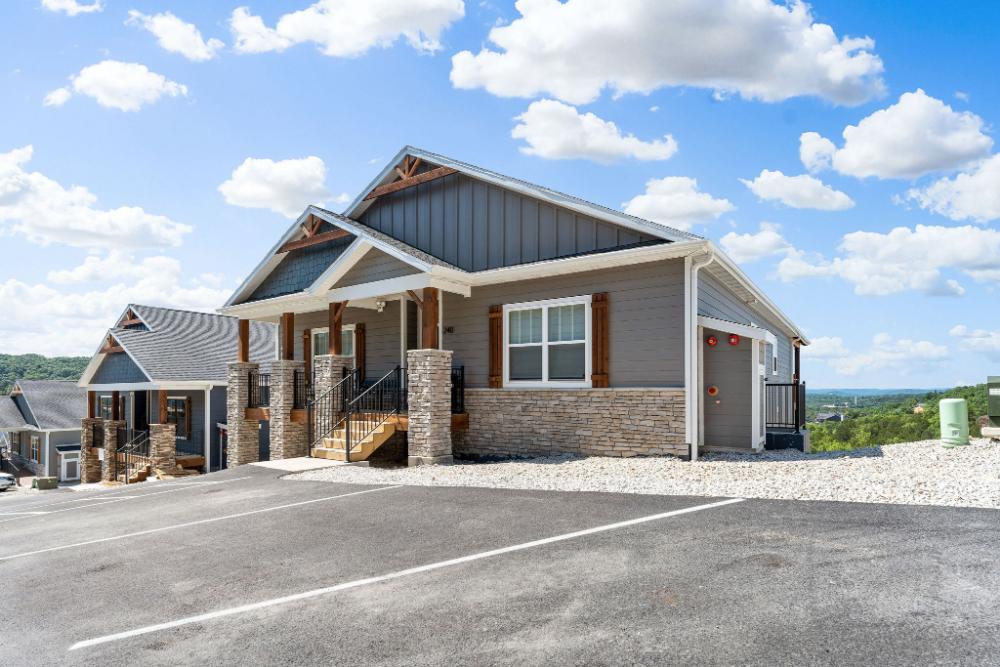 Welcome to your home away from home—easy parking, great curb appeal, and those Table Rock views just beyond!
