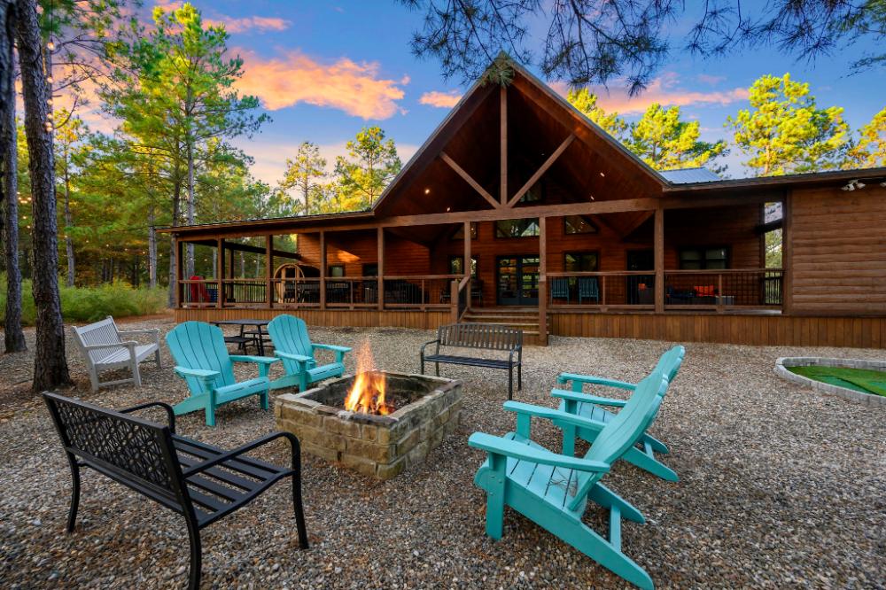 The Conifer Cabin is the perfect cabin in the woods with fire pit, games, entertainment, and that cozy, rustic, yet elevated feel throughout the property.