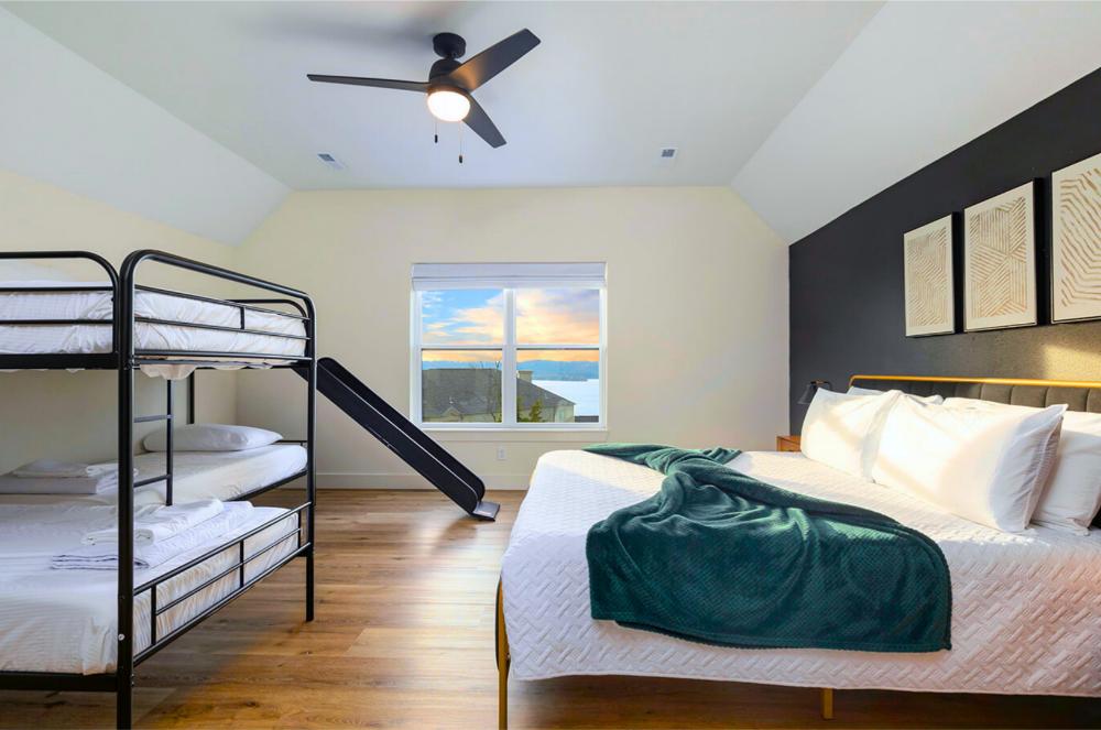 Wake up to lake views,this king bedroom and an ensuite bathroom is fun and functional for the whole family. Send the kids down the slide in this awesome family-friendly suite!