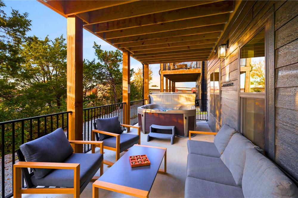 Kick back on the covered deck, sink into the hot tub, and enjoy a laid-back evening surrounded by peaceful views and cozy seating.