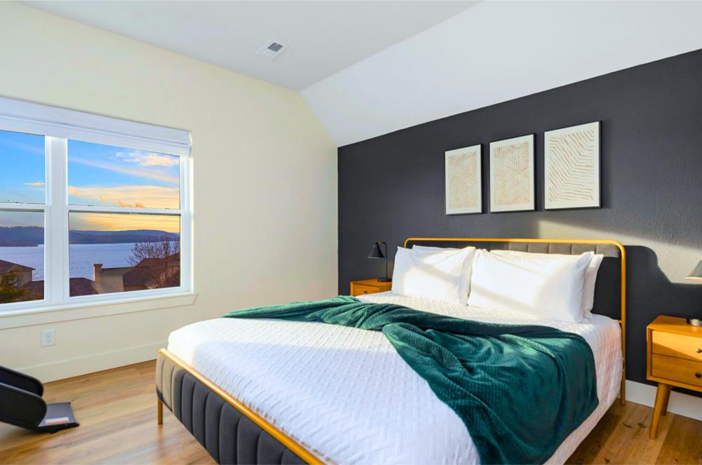 Enjoy peaceful lake views from this cozy king bedroom with a private ensuite bathroom.