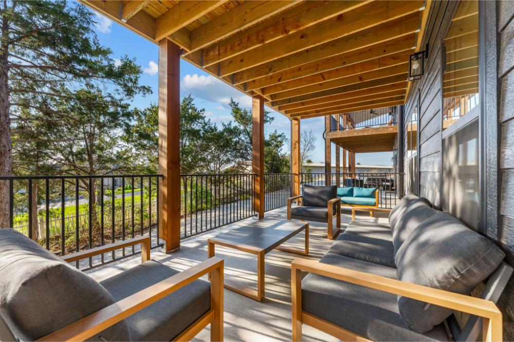 Cozy seating and forest views make this lower deck the perfect place to relax and recharge.