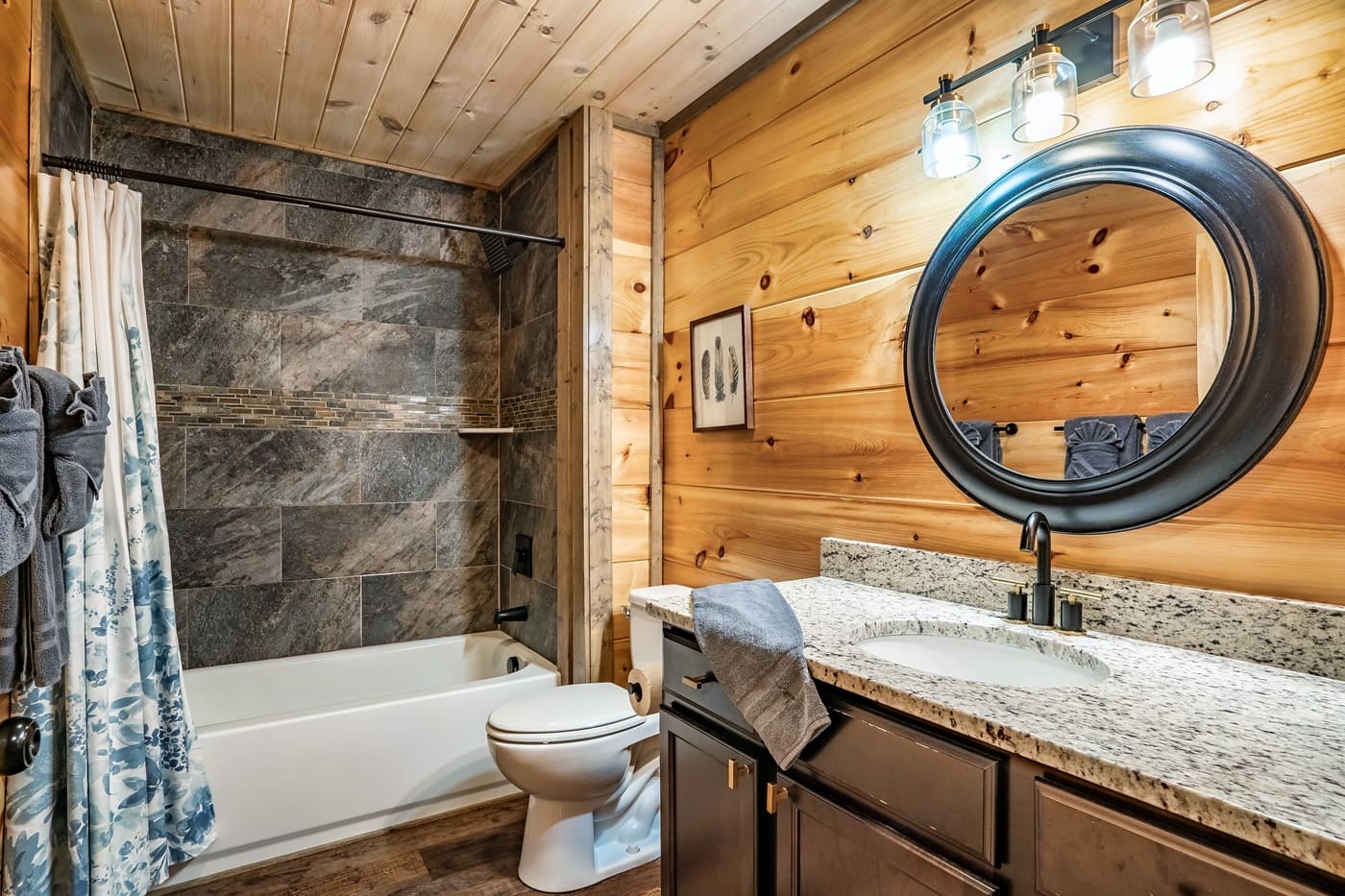 Bathroom featuring a tub and shower combination with modern finishes.