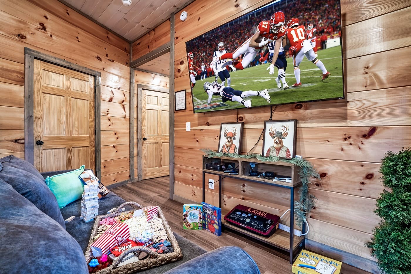 Kick back with a movie or game night in this cozy hangout space with plenty of seating and entertainment.