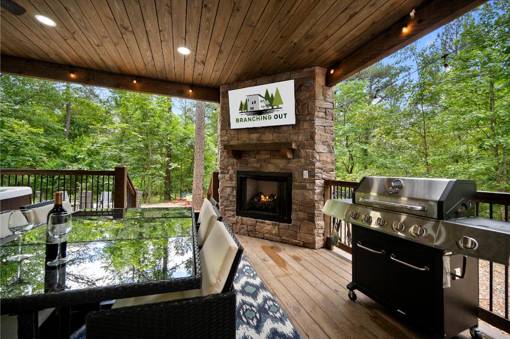Grill dinner and relax by the fire with this outdoor deck designed for easy and comfortable living.