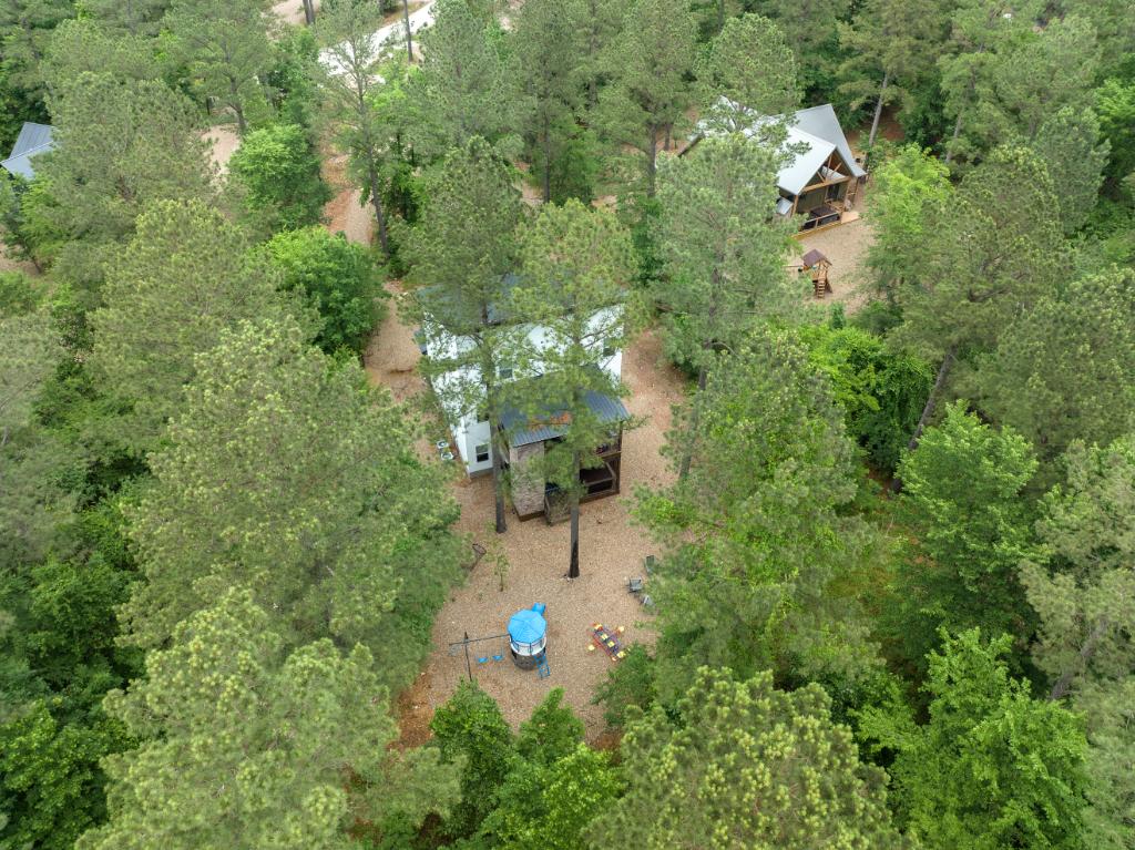 Surrounded by mature trees, Branching Out offers a woodland escape with a playground, fire pit, and plenty of space for everyone.