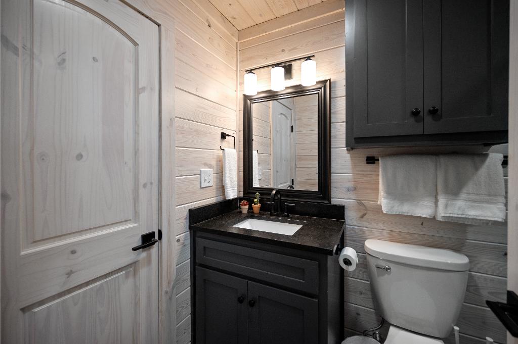 Ensuite bathroom with built-in closet for additional storage.