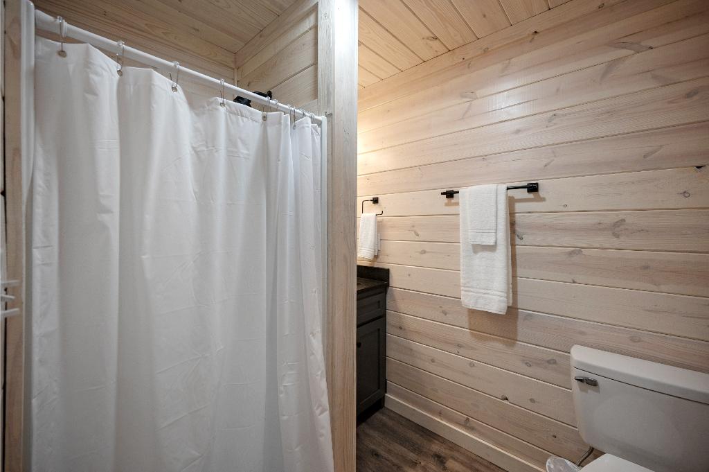 A full bathroom in the bunk room provides added convenience and comfort for guests.