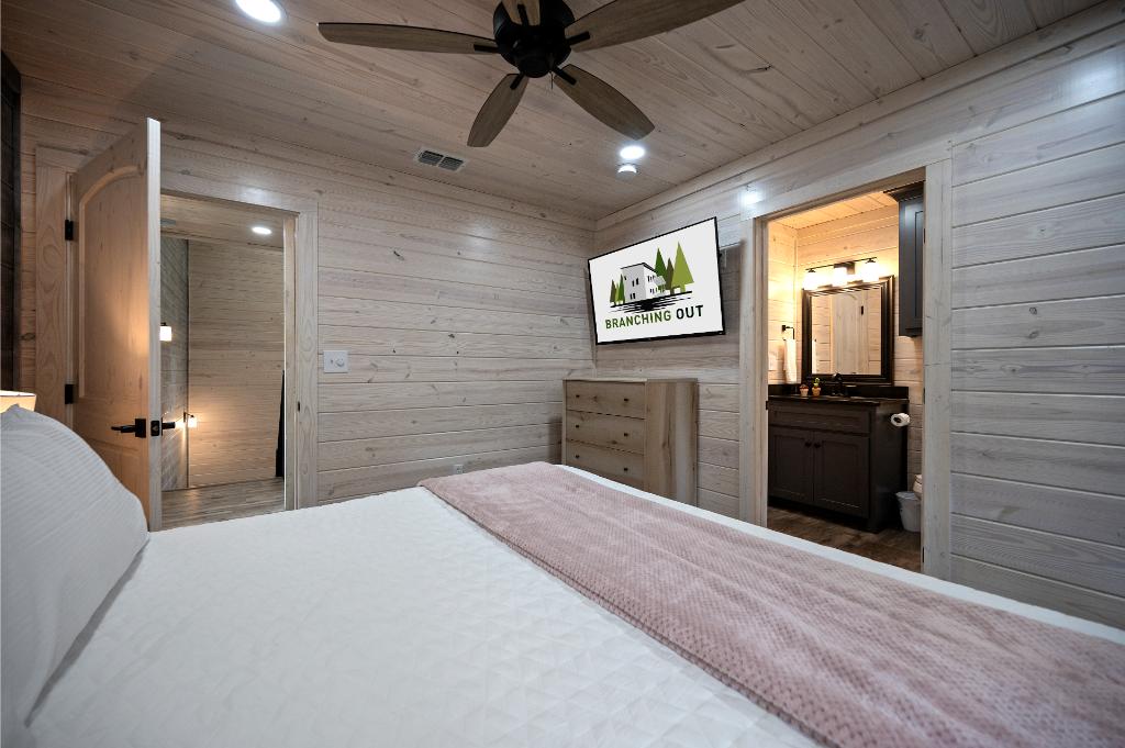 King bedroom equipped with modern comforts and entertainment options.
