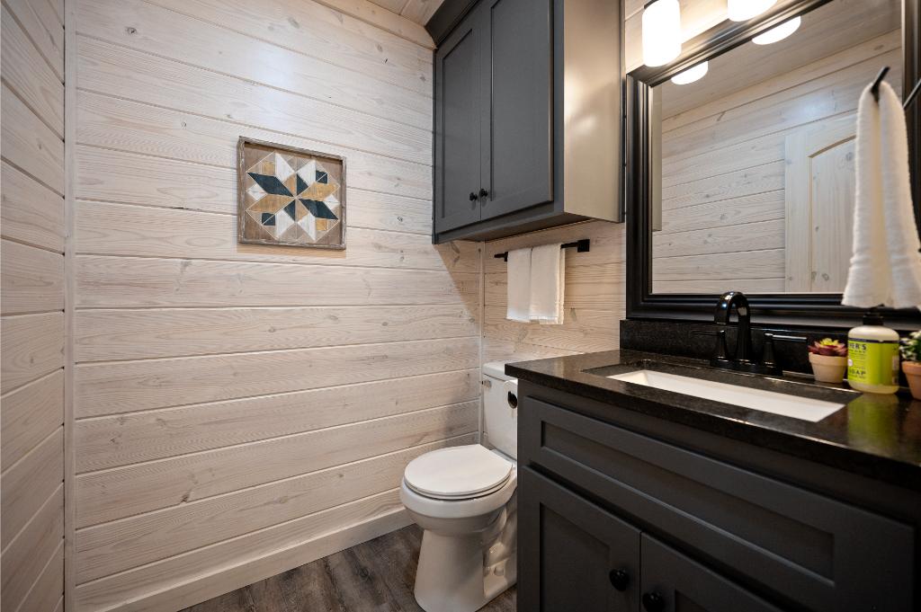 Movie nights are easier with this upstairs powder room conveniently located nearby.