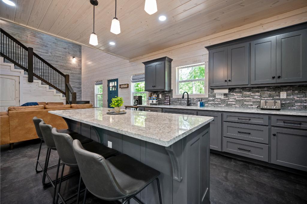 Kitchen with large island for meal prep and seating.