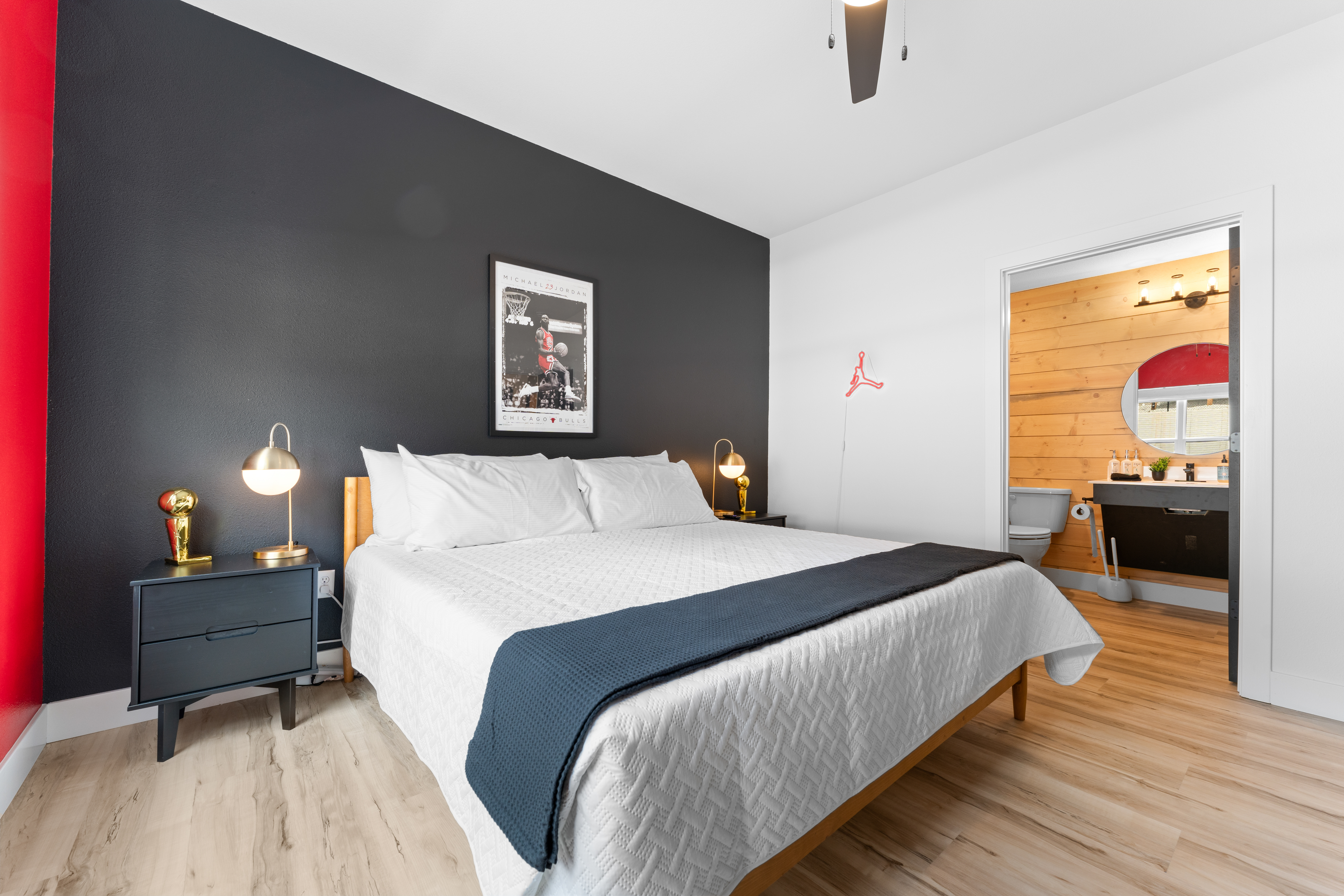 Michael Jordan is the GOAT! Enjoy this themed king bedroom with wide door access to the wheelchair accessible bathroom and shower.