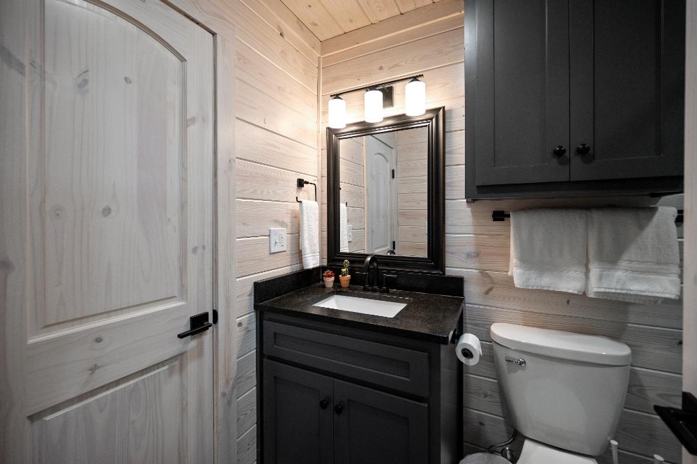 Ensuite bathroom with built-in closet for additional storage.